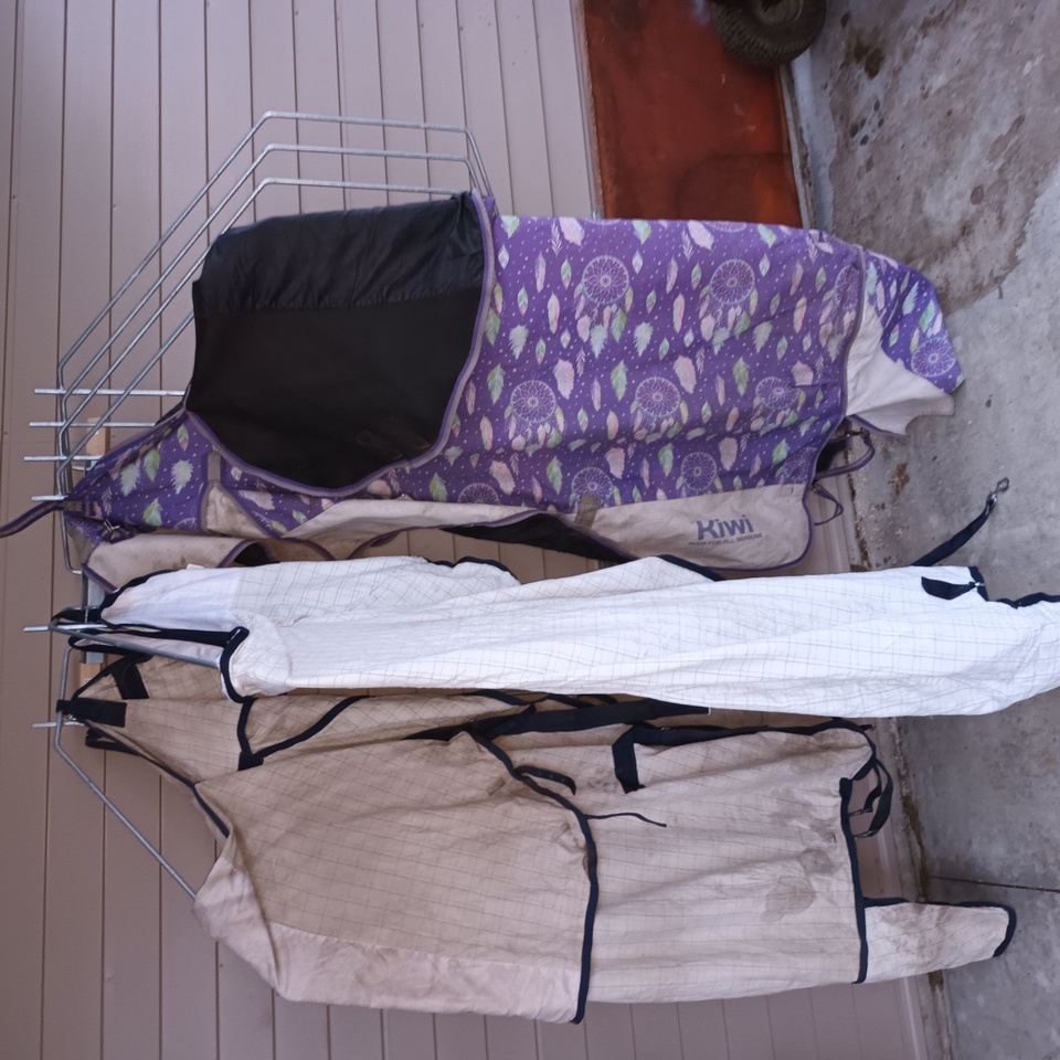 Pivoting Horse cover rack